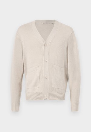 Beige knitted cardigan with long sleeves, V-neck, four buttons, two front pockets, and ribbed cuffs and hem.