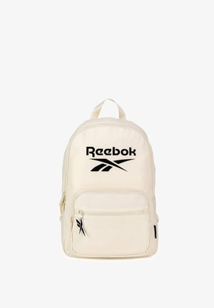 Mochila beige de Reebok con un gran logo negro en la parte frontal, bolsillo delantero con cremallera y tiradores con diseño de logo.