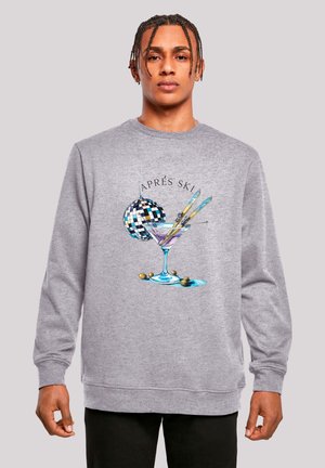 Gray sweatshirt featuring a graphic design of a martini glass, skis, a disco ball, and the text "Après Ski." Relaxed fit, crew neckline.