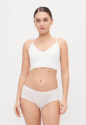 White cotton bralette with thin straps and a v-neckline, paired with matching white hipster briefs, featuring a smooth, stretchy texture.