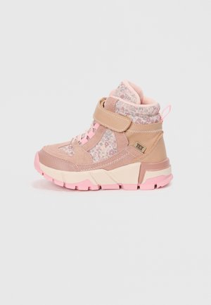 Pink ankle boots with floral fabric panels, textured suede, and a Velcro strap. Features a chunky pink outsole and padded collar.