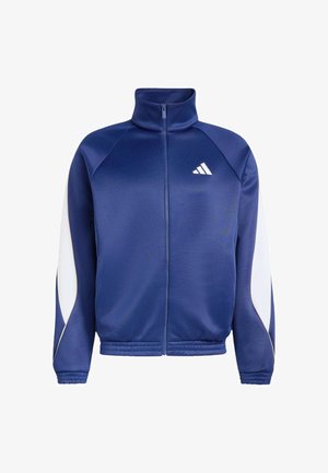 Giacca sportiva blu navy con zip, dettagli bianchi sulle maniche e logo Adidas bianco sul petto, con collo alto e polsini elastici.
