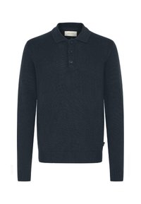 Tamno plava dugosleeve polo majica, rebrasta tekstura, trodijelna dugmad, i prilagođeni manžeti. Materijal izgleda mekano i pomalo rastezljivo.