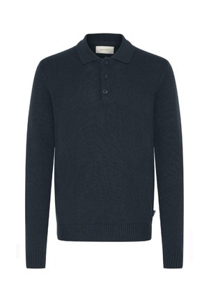 Tamno plava dugosleeve polo majica, rebrasta tekstura, trodijelna dugmad, i prilagođeni manžeti. Materijal izgleda mekano i pomalo rastezljivo.