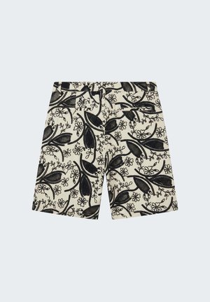 Shorts beige a vita alta con motivi floreali e fogliari neri ricamati, dotati di passanti per cintura e dettaglio con tasca posteriore.