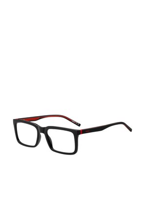Occhiali da lettura neri a forma rettangolare con accenti rossi sulle astine. Materiale in acetato liscio, noto per le montature spesse e la texture interna a contrasto.