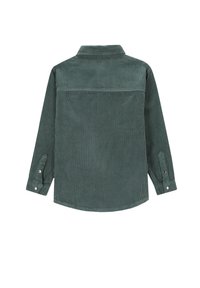 Zielona koszula z kordurowego materiału, z długimi rękawami, zapinanymi mankietami i zaokrąglonym dołem. Posiada szew na plecach oraz teksturowany prążkowany wzór.