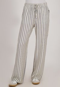 Gestreepte broek met wijde pijpen in crèmekleur en marineblauw, voorzien van een elastische tailleband met een trekkoord, textuurstof en een casual pasvorm.