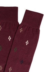 Calzini bordeaux con una texture lavorata a maglia e motivi a diamante in beige, verde e blu, rifiniti con polsini a coste.