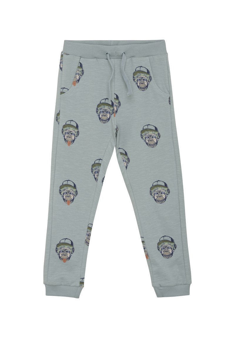 Hellegraue Jogginghosen aus weichem Material, mit einem Allover-Druck von Affengesichtern, die Hüte tragen. Sie haben gerippte Bündchen und einen elastischen Bund.