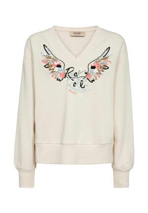 Kremasta majica s V-izrezom, dugim rukavima, rebrastim manšetama i rubom, ukrašena krilima i tekstom u kurzivu na prednjoj strani.