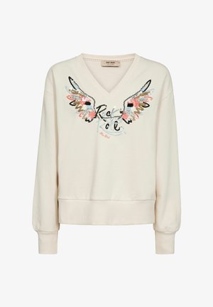 Krém V-nyakú pulóver hosszú ujjakkal, bordázott mandzsettákkal és szegéllyel, díszített szárnyakkal és elöl írott betűs szöveggel.