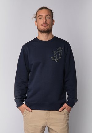 Navyblaues Sweatshirt aus Baumwolle mit Rundhalsausschnitt, langen Ärmeln und einem kleinen grünen Grafik eines Vogels mit dem Text "self love" auf der Brust.