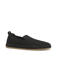 Scarpe nere slip-on con una tomaia testurizzata, pannelli elasticizzati ai lati e un accento intrecciato sulla suola, dotate di una soletta in gomma piatta.