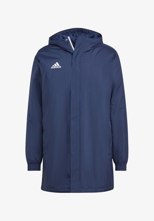 Laivastonsininen vedenpitävä takki hupulla, joustavat hihansuut, etuvetoketju ja sivutaskut. Oikeassa ylärinnassa valkoinen Adidas-logo.