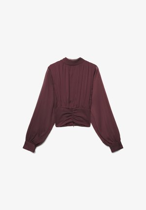 Bordeauxfarbene, kurz geschnittene Bluse mit langen Ärmeln, die ein plissiertes Design und eine geraffte Taille aufweist. Hergestellt aus leichtem, strukturiertem Stoff mit hohem Halsausschnitt.