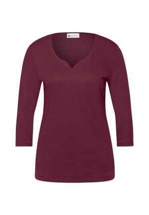 Dlouhý rukáv v barvě burgundské červené s výstřihem do V, vyrobený z měkkého bavlněného materiálu, s hladkou strukturou bez viditelných vzorů nebo zdobení.