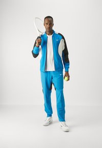 Nike Performance Jogginghose - light photo blue/black/white
