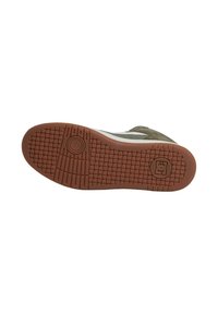 Sneaker sole in brown rubber with a textured surface and a circular logo. Features white side accents and a green suede upper.