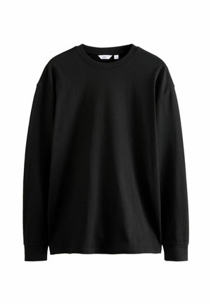 Czarny bawełniany t-shirt z długim rękawem i okrągłym dekoltem z prążkowanymi mankietami, pokazany rozłożony na białym tle.