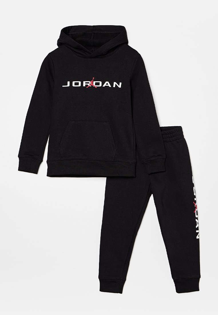 Black hoodie and sweatpants set made of cotton, featuring a kangaroo pocket, white "JORDAN" logo, and red graphic accents on the hoodie.