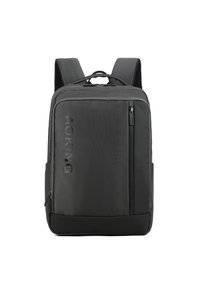 Sac à dos noir en nylon, avec poche frontale zippée, bretelles rembourrées et surface texturée avec détail de logo.