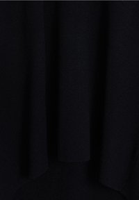 Black knitted fabric with a soft, smooth texture. Features a draped design and slight variations in weave, creating depth and visual interest.