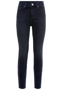 Jeans skinny de tiro alto en tela de denim oscuro, con una textura suave, accesorios de cobre, cinco bolsillos y un ajuste ceñido.