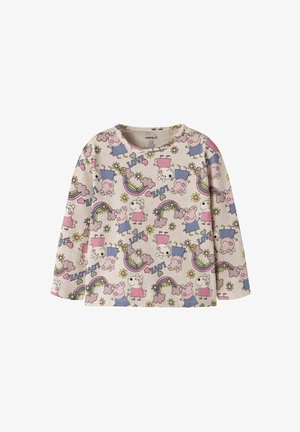 Dziecięca koszulka z długim rękawem z jasnobeżowej bawełny z kolorowym wzorem z postaciami z kreskówek, tęczami, sercami i kwiatami.