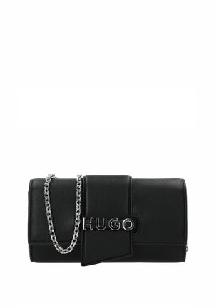 Black leather wallet with a folded design, silver chain strap, and a prominent silver "HUGO" logo on the front. Smooth texture with clean lines.