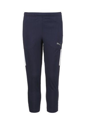 Tamsiai mėlynos capri kelnės, pagamintos iš tamprios medžiagos, turinčios elastingą juosmenį ir baltus šoninius akcentus. Logo spausdintas ant kairės kojos.
