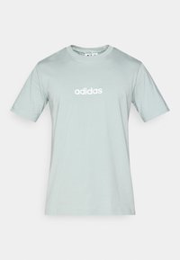 Hele-roheline puuvillane lühikeste varrukatega t-särk, ümmarguse kaelusega, ees keskel valge "adidas" logo. Sile tekstuur, standardsuurus.