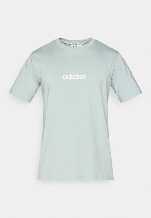 Hele-roheline puuvillane lühikeste varrukatega t-särk, ümmarguse kaelusega, ees keskel valge "adidas" logo. Sile tekstuur, standardsuurus.