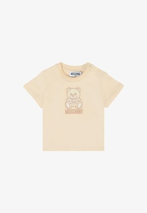 T-shirt in cotone beige con maniche corte, caratterizzato da una grafiche di un orsetto marrone chiaro e il testo "Toy Moschino" sotto il design.