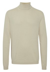 Heller beiger Rollkragenpullover aus einem weichen Strickmaterial, mit langen Ärmeln und einem gerippten Kragen in taillierter Silhouette.