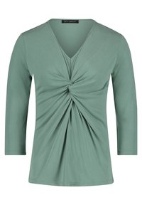 Světle zelený top s dlouhými rukávy a výstřihem do V, s detailním twistem v přední části, vyrobený z hladkého, elastického materiálu. Čistý, jednoduchý design.