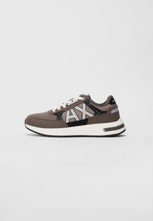 Low-top gray and black sneaker with white laces, white sole, and large "AX" logo on the side.