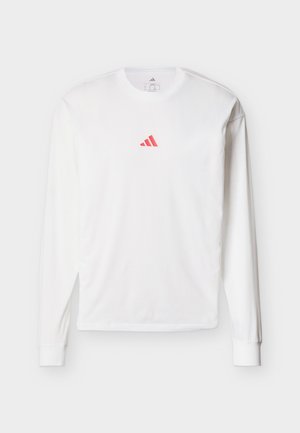White long-sleeve t-shirt with a small red triangular logo centered on the chest, displayed on a plain background.