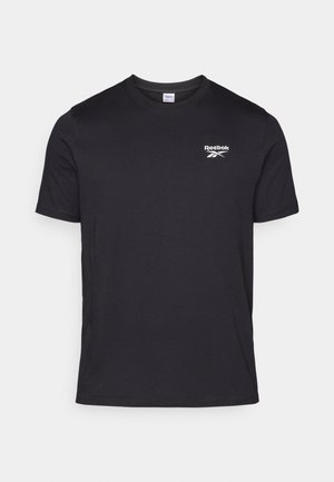 T-shirt en coton noir avec un col rond et des manches courtes. Comprend un logo Reebok blanc sur la zone gauche de la poitrine. Texture lisse.