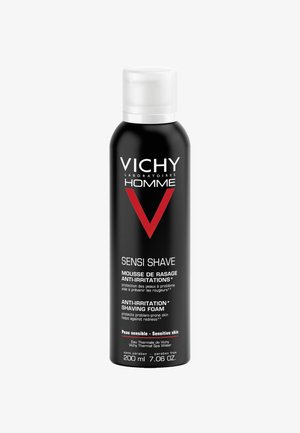 Schwarze Aerosoldose mit einem weißen und roten Etikett, das die Marke "Vichy" und den Produktnamen "Sensi Shave" zeigt, sowie Details zu empfindlicher Haut.