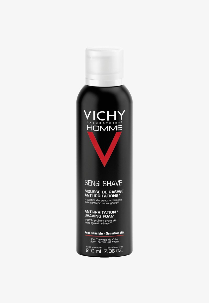Schwarze Aerosoldose mit einem weißen und roten Etikett, das die Marke "Vichy" und den Produktnamen "Sensi Shave" zeigt, sowie Details zu empfindlicher Haut.