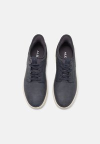 Dark navy shoes with a matte leather finish, round toe, lace-up design, textured accents on the upper, and light-colored rubber sole.