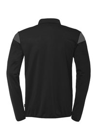 Zwarte longsleeve shirt van een textuurstof met grijze accenten op de schouders. Voorzien van een kraag en een rechte zoom.