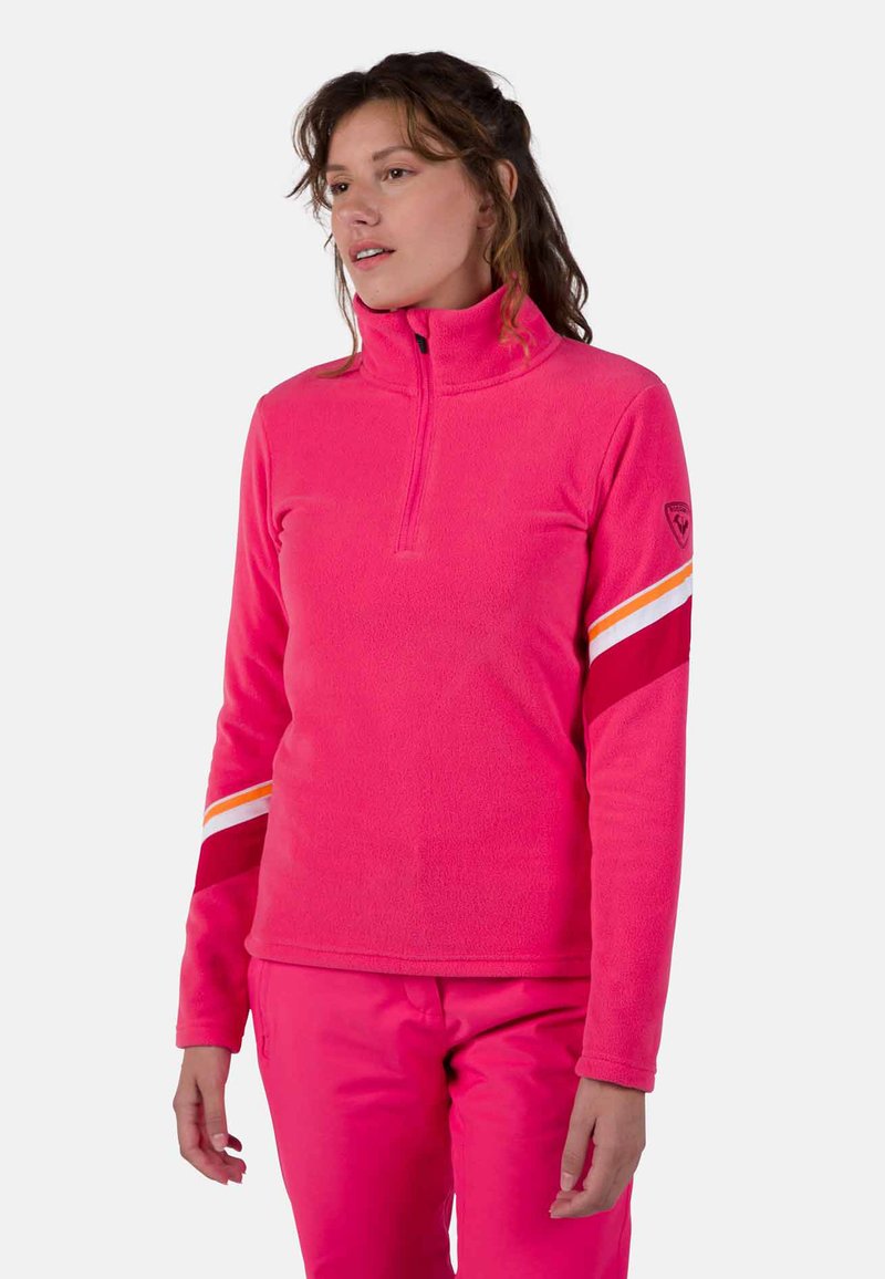Fleece pullover in felroze met een hoge kraag, kwart rits, en rode, witte en oranje strepen op de mouwen.