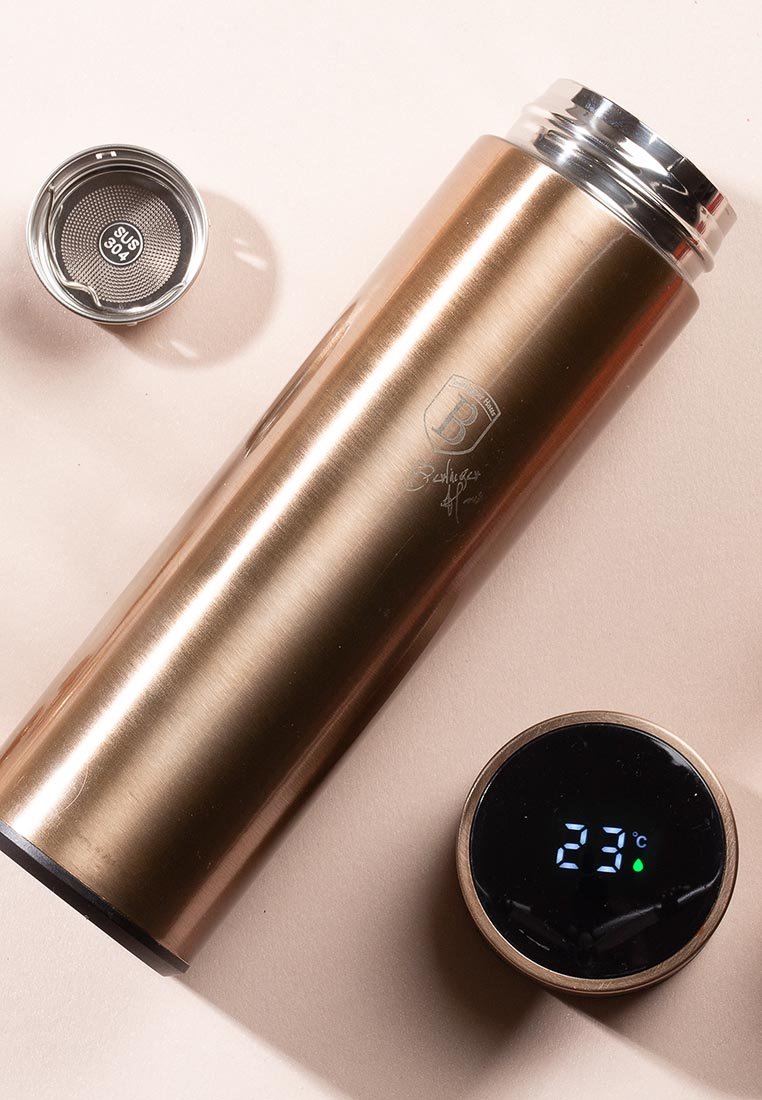 Edelstahl-Thermoskanne in bronzefinish mit glatter Textur; verfügt über ein kreisförmiges Temperaturdisplay mit einer Messung von 23 °C.