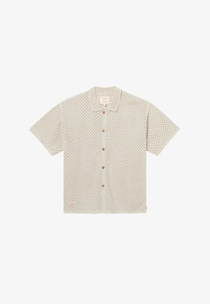 Lühikeste varrukatega beež kootud särk kraega, ees puidust nööpid ja väike rinnatasku.