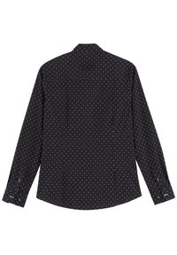 Chemise noire à manches longues avec des pois blancs, poignets à boutons et col standard. Tissu lisse avec une coupe décontractée et un détail de patte de boutonnage au dos.