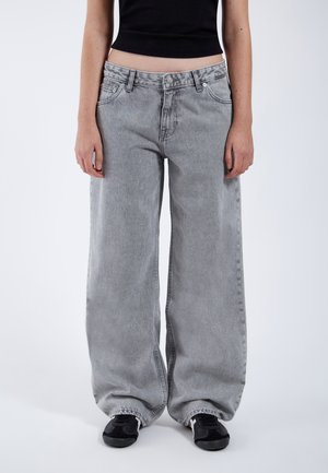 Gray wide-leg jeans with a slightly faded finish, featuring a classic five-pocket design and cuffed hems. Worn with black sneakers.