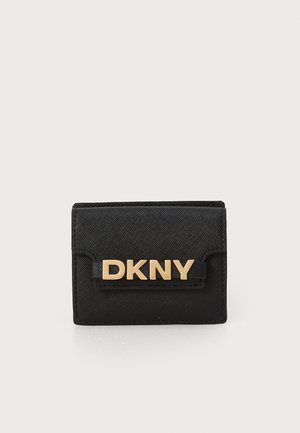 Black fabric wallet with a textured finish, featuring a gold metallic "DKNY" logo on the front and a flap closure. Compact design.