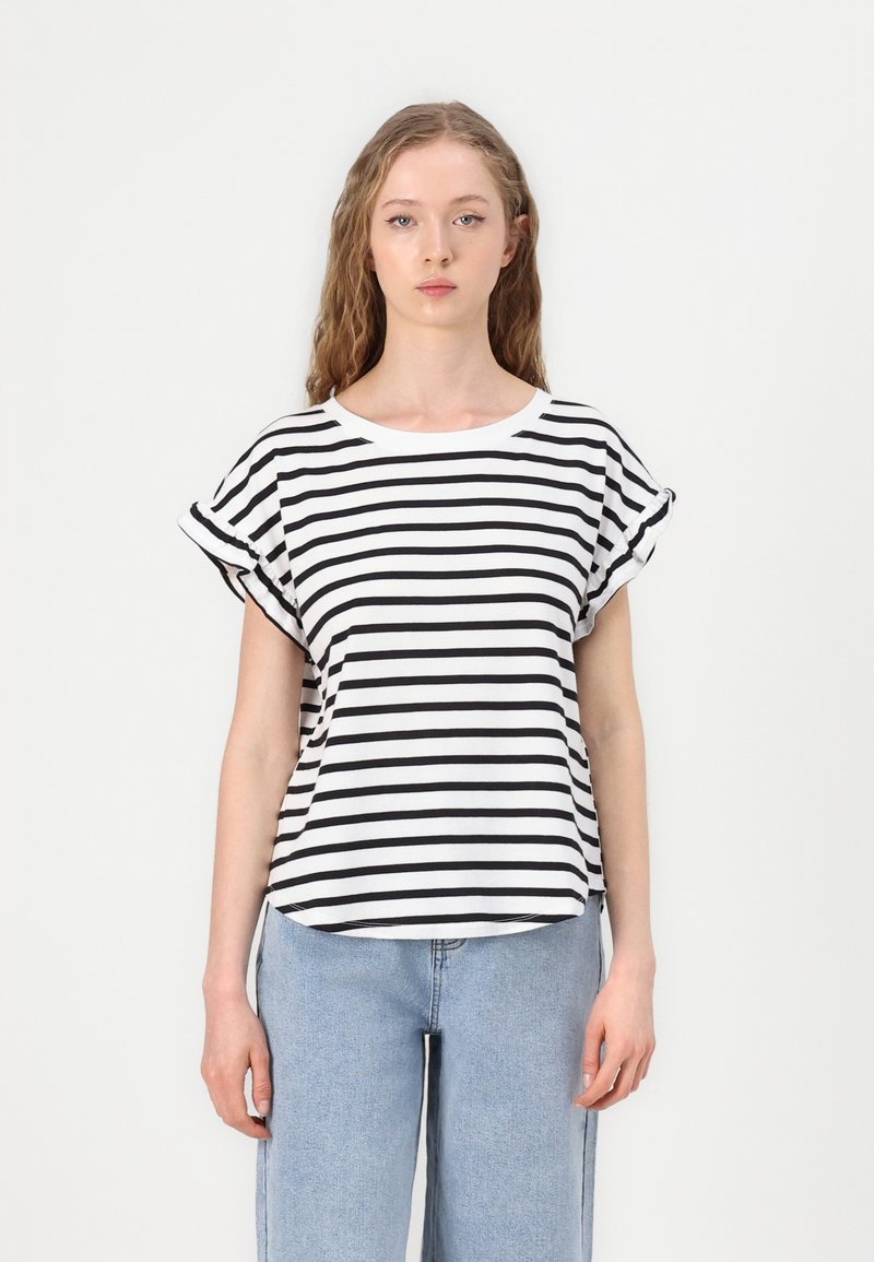 Striped t-shirt in black and white, made of soft fabric. Features a round neckline and rolled short sleeves, with a loose fit and curved hem.